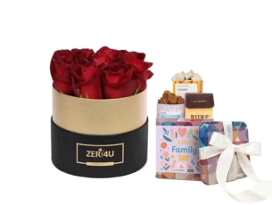 סידור ורדים בקופסה עגולה בגווני שחור וזהב, בשילוב מארז שוקולד מבית מקס ברנר