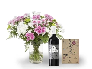 זר חרציות צבעוני, בשילוב יומן יין ויין אדום